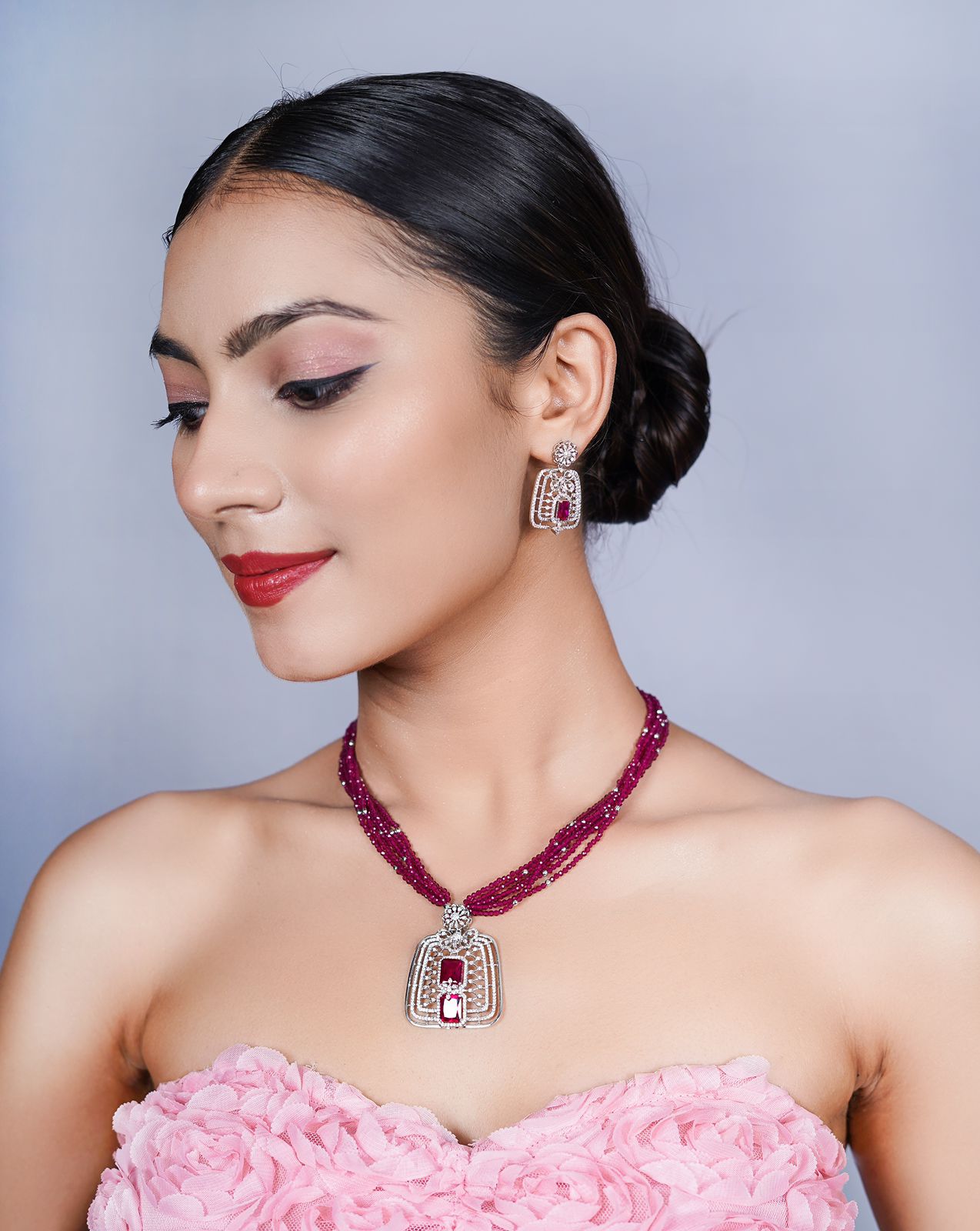 ruby-hued pendant and earring set